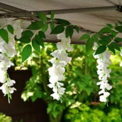 Solar Powered 180cm Artificial Leaf Garland With Wisteria Flowers - Warm White -Garden Series Store 379258 180cm solar powered artificial leaf garland with wisteria flowers 20 warm white micro leds
